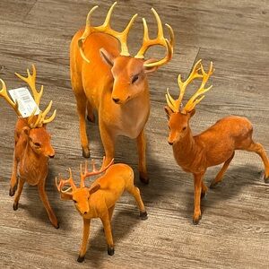 Flocked Deer Set of 4 . Various Sizes. Nice perfect for Christmas Decor ..